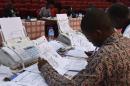 Niger's Independent Election Commission (CENI) members check the results of the presidential elections on March 21, 2016 at the Palais des Congres in Niamey