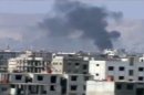 This image taken from video obtained from Ugarit News on Friday, Feb. 8, 2013, which has been authenticated based on its contents and other AP reporting, show smoke rising from fighting near a main highway in Damascus, Syria. Rebels pushed forward in their battle with the Syrian army in northeastern Damascus on Friday, shutting down a main highway with a row of burning tires, activists said. A number of rebel brigades launched a campaign Wednesday to attack regime checkpoints along the highway and have been clashing in the area since. The government has responded by shelling number of rebel areas nearby. (AP Photo/Ugarit News via AP video)