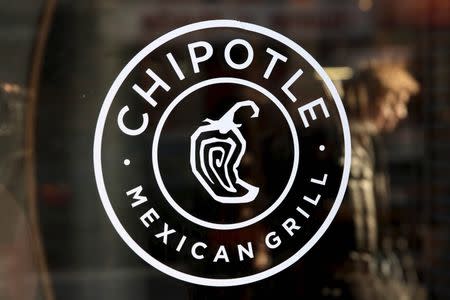 A Chipotle logo is seen on a store entrance in Manhattan, New York
