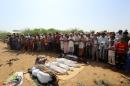 Yemenis attend the funeral of members of the same family on October 8, 2016, a day after they were killed in a reported airstrike by Saudi-led coalition air-planes that hit their house in Bajil, in the western province of Houdieda