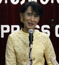 Myanmar opposition leader Aung San Suu Kyi talks to journalists during a press conference at the headquarters of her National League for Democracy Party in Yangon, Myanmar Tuesday, July 3, 2012. (AP Photo/Khin Maung Win)
