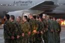 Soldiers of the German air force prepare to enter an A310 MRT aerial refuelling jet before it takes off from the Cologne Wahn base near Cologne, western Germany, December 10, 2015