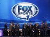 Freer stands on stage with Fox Sports television personalities in New York