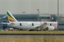 CORRECTING THE SPELLING OF SHEBA General view of the Air Ethiopian Boeing 787 Dreamliner 'Queen of Sheba' aeroplane, on the runway near Terminal 3, at Heathrow Airport, London, Friday July 12, 2013. Two Boeing 787 Dreamliner planes ran into trouble in England on Friday, with a fire on one temporarily shutting down Heathrow Airport and an unspecified technical issue forcing another to turn back to Manchester Airport. The incidents are unwelcome news for Chicago-based Boeing Co., whose Dreamliners were cleared to fly again in April after a four-month grounding due to concerns about overheating batteries. The fire at Heathrow involved an empty Ethiopian Airlines plane, which was parked at a remote stand of the airport after arriving at the airport. British police said the fire is being treated as unexplained, and that there were no passengers on board at the time of the fire. (AP Photo/ Anthony Devlin/PA) UNITED KINGDOM OUT