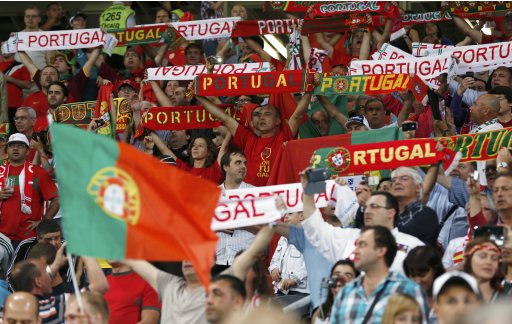 Portugal's fans cheer before their Euro 2012 semi-final soccer match against Spain in Donetsk