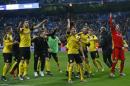 Borrusia Dortmund players celebrate a draw at the end of the Champions League, Group F, soccer match between Real Madrid and Borrusia Dortmund at the Santiago Bernabeu stadium in Madrid, Spain, Wednesday, Dec. 7, 2016. (AP Photo/Francisco Seco)