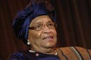 Sirleaf smiles during an onstage newsmakers interview with Reuters in Washington