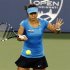 Li Na of China hits a return to Venus Williams of the U.S. during their women's singles semi-final match at the Cincinnati Open tennis tournament in Cincinnati