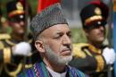 Afghan President Karzai attends an event to commemorate Afghanistan's 95th anniversary of independence in Kabul