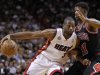 Miami Heat's Dwyane Wade drives against Chicago Bulls' Jimmy Butler in the first half of their NBA basketball game in Miami, Florida