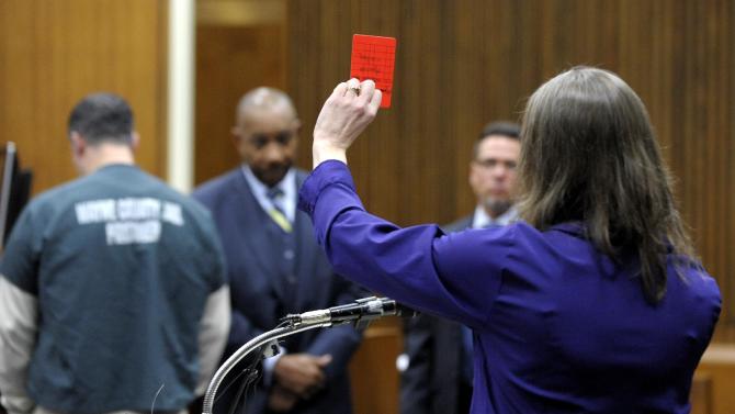 Jon Bieniewicz&#39;s widow, Kris Bieniewicz, addresses the court as she gives the last victim&#39;s impact statement and holds up a soccer &quot;red flag&#39; in the courtroom of Wayne County Circuit Court Judge Thomas Cameron on Friday, March 13, 2015 in Detroit.  Bassel Saad  was sentenced to at least eight years in prison for a punch that killed  Bieniewicz, a Detroit-area referee.  (AP Photo/Detroit News, Todd McInturf)  DETROIT FREE PRESS OUT; HUFFINGTON POST OUT
