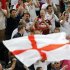 England soccer fans cheer before their Group D Euro 2012 soccer match against Ukraine at the Donbass Arena in Donetsk