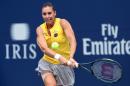 Flavia Pennetta of Italy plays a shot against Gabriela Dabrowski of Canada during the Rogers Cup on August 10, 2015 in Toronto
