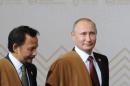 Russian President Putin and Brunei's Sultan Bolkiah arrive for family photo during APEC Summit in Lima