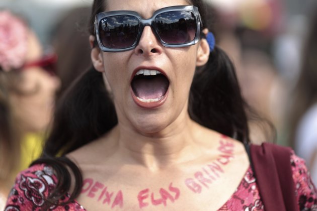 A woman takes part in the Marcha das Vadias protest in Brasilia