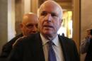 U.S. Senator John McCain (R-AZ) leaves after Senator Dianne Feinstein's (D-CA) speech on the Senate floor on Capitol Hill, in Washington