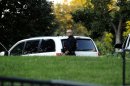 A member of the US Secret Service takes up position behind a tree on the North Lawn on September 16, 2013