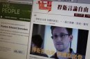 Statement by Hong Kong online media supporting Snowden displayed alongside White House website on computer screen in Hong Kong