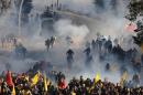 Turkish police fire tear gas and water cannon during a demonstration called by teachers unions against the government's education policies on November 23, 2013 in Ankara