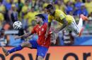 Chile's Mauricio Pinilla, left, and Brazil's Luiz Gustavo battle for the ball during the World Cup round of 16 soccer match between Brazil and Chile at the Mineirao Stadium in Belo Horizonte, Brazil, Saturday, June 28, 2014. (AP Photo/Andre Penner)
