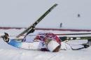 Sweden's Emil Joensson sits in the snow after the men's final of the cross-country sprint at the 2014 Winter Olympics, Tuesday, Feb. 11, 2014, in Krasnaya Polyana, Russia. (AP Photo/Matthias Schrader)