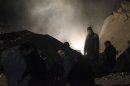 People search for survivors in Aleppo's Tariq al-Bab neighbourhood
