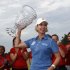 Karrie Webb, of Australia, holds up the trophy after winning the ShopRite LPGA Classic golf tournament in Galloway Township, N.J., Sunday, June 2, 2013. Shanshan Feng, of China, came in second. (AP Photo/Mel Evans)