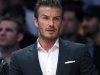 British soccer star David Beckham sits courtside as the Los Angeles Lakers play their season opening game