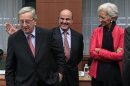 Spain's Economy Minister De Guindos, Luxembourg's PM Juncker and IMF Managing Director Lagarde attend a Eurogroup meeting in Brussels