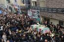 Iranian mourners carry the casket of Revolutionary Guards member Abdollah Bagheri, who was killed fighting in Syria, during his funeral in Tehran on October 29, 2015