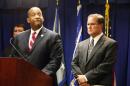 Andre Birotte, U.S. Attorney for the Central District of California, at podium, and Bill Lewis, Assistant Director in Charge of the FBI's Los Angeles Division, right, take questions on the five criminal cases filed against 18 current and former Los Angeles County sheriff's deputies as part of an FBI investigation into allegations of civil rights abuses and corruption in the nation's largest jail system, during a news conference in Los Angeles, Monday, Dec. 9, 2013. The FBI has been investigating allegations of excessive force and other misconduct at the county's jails since at least 2011. (AP Photo/Nick Ut)