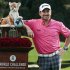 Graeme McDowell poses with the trophy after winning the World Challenge golf tournament at Sherwood Country Club in Thousand Oaks, Calif., Sunday, Dec. 2, 2012. (AP Photo/Bret Hartman)