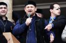 Chechen President Ramzan Kadyrov (C) says Chechen spies have been sent to infiltrate the Islamic State group