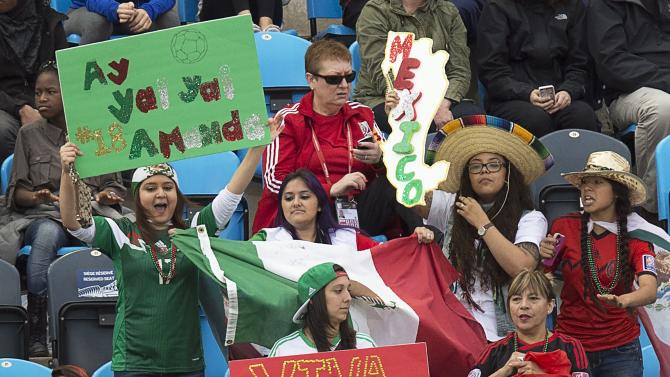 Mexico fans cheer as they play Colombia in a FIFA Women&#39;s World Cup soccer match in Moncton, New Brunswick, Canada, Tuesday, June 9, 2015. (Andrew Vaughan/The Canadian Press via AP) MANDATORY CREDIT