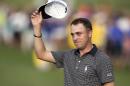 FILE - In this Jan. 15, 2017, file photo, Justin Thomas acknowledges to the gallery after winning the Sony Open golf tournament in Honolulu. Thomas is set to play in the Waste Management Phoenix Open this week, coming off a two-break after a dominating Hawaiian sweep. (AP Photo/Marco Garcia, File)