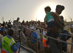 A Djibouti security official carries a young girl down&nbsp;&hellip;