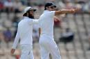 Moeen Ali (left) and Alistair Cook talk tactics during the third Test against India in Southampton on July 29, 2014
