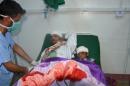 A man and a boy who were injured in a rocket attack on a village in southwest Yemen, rest on a hospital bed at Dhamar hospatil in Dhamar province