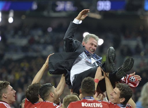 Bayern Munich head coach Jupp Heynckes is thrown in the air by his players after winning the Champions League Final soccer match against Borussia Dortmund at Wembley Stadium in London, Saturday May 25