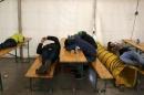 Migrants sleep on the compound of the Berlin Office of Health and Social Affairs (LAGESO) while waiting for their registration process in Berlin