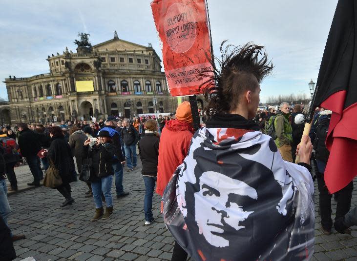 Participants of a counter demonstration gather in downtown Dresden, Germany, Saturday Feb. 6, 2016. Police in Dresden say they expect about...