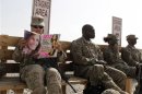 File photo of U.S. Army soldier SSG Norma Gonzales reading a magazine in Kandahar
