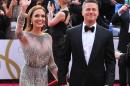 Angelina Jolie, left, and Brad Pitt arrive at the Oscars