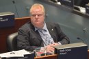 Toronto Mayor Rob Ford sits during a City council meeting at Toronto City Hall on Tuesday May 21, 2013. Ford ignored a crush of reporters waiting outside his city hall office this morning in the hopes he would address allegations that he was recorded on video appearing to smoke crack cocaine. (AP Photo/THE CANADIAN PRESS/Nathan Denette)