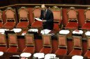 Deputy Prime Minister and Interior Minister Angelino Alfano reads a document at the Upper house of the parliament in Rome