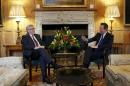 Britain's Prime Minister David Cameron (R) and European Commission President Jean-Claude Juncker (L) meet at Chequers, the prime minister's official country residence, near Ellesborough on May 25, 2015