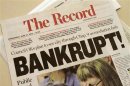 A local newspaper headline announces bankruptcy in Stockton, California