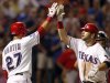 Texas Rangers' Moreland is congratulated by Martin after hitting a home run against the Houston Astros in the eighth inning of their MLB interleague baseball game in Arlington