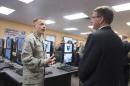 Secretary of Defense Ash Carter is briefed on the capabilities of the National Guard Cyber Unit at Joint base Lewis-McChord Washington