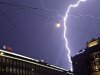 File photo of lightning over headquarters of Swiss banks UBS and Credit Suisse during a thunderstorm in Zurich